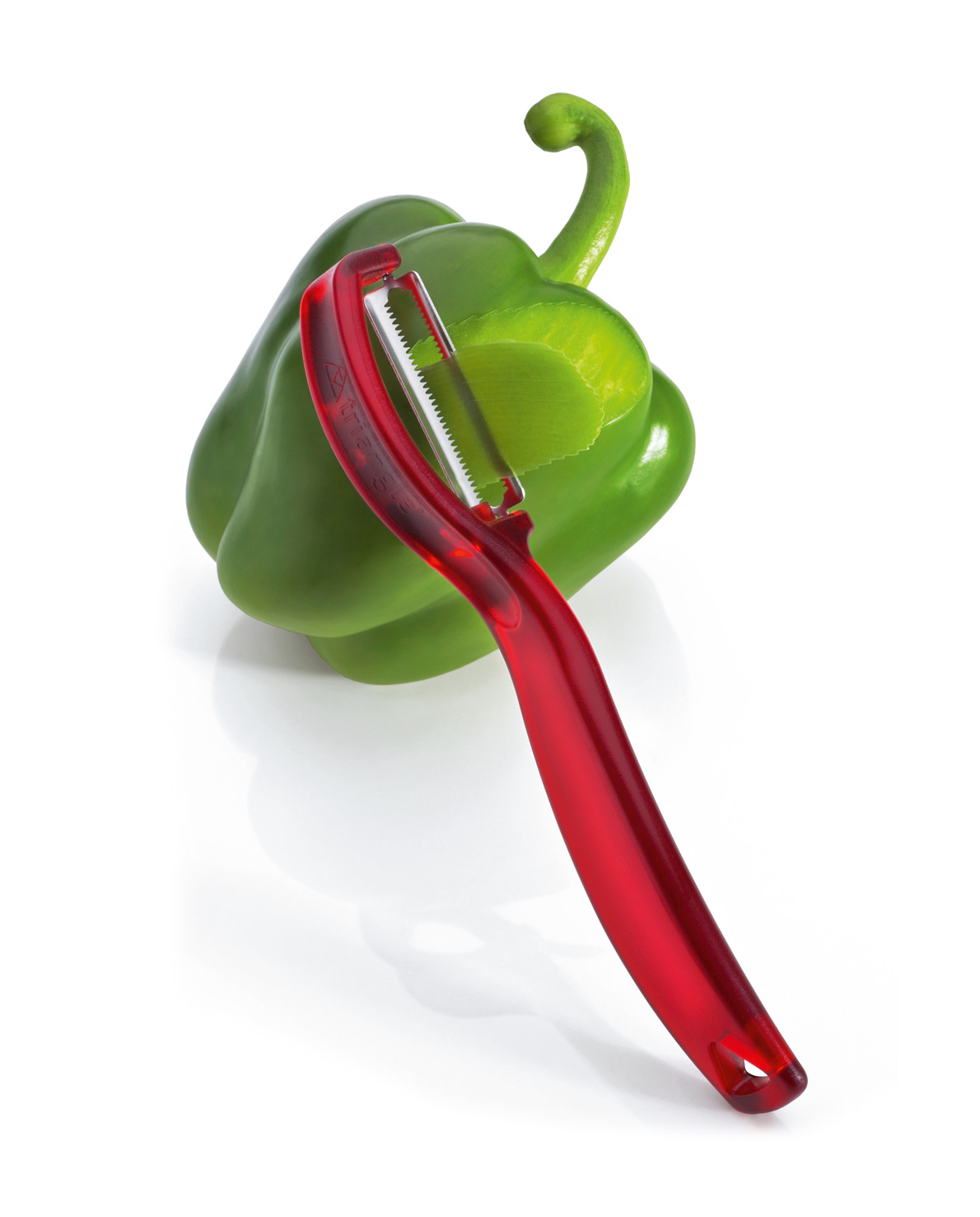 triangle tomato peeler peeling a green pepper